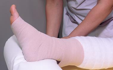 a bandaged leg in preparation for MLD